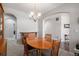 Elegant dining area showcases an oval wood table and views to multiple rooms at 2558 Northview Pl, Castle Rock, CO 80104