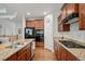 Gourmet kitchen with granite countertops, stainless steel appliances, and hardwood flooring at 2558 Northview Pl, Castle Rock, CO 80104