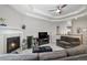 Spacious living room with cozy seating, a fireplace, and easy access to the second floor at 2558 Northview Pl, Castle Rock, CO 80104