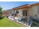 Outdoor patio area with comfortable seating, grill, and a well-maintained lawn at 2558 Northview Pl, Castle Rock, CO 80104