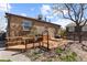 Exterior features a multi-tiered wooden deck and a brick home at 111 S Perry St, Denver, CO 80219