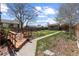 Spacious backyard featuring a wooden deck, shed, and well-maintained lawn at 111 S Perry St, Denver, CO 80219