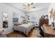 Bedroom with hardwood floors, a large window, and a desk for study and work at 111 S Perry St, Denver, CO 80219