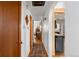 Hallway providing access to multiple rooms and an open view of the kitchen area at 111 S Perry St, Denver, CO 80219