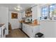 Well-lit kitchen with modern appliances, wood countertops, and ample storage space at 111 S Perry St, Denver, CO 80219