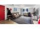 Cozy living room featuring a comfortable sofa, accent chair, and stylish blue patterned rug at 111 S Perry St, Denver, CO 80219