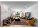 Bright and airy living room featuring hardwood floors, a large sectional, and abundant natural light at 111 S Perry St, Denver, CO 80219