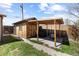 Backyard shed with covered patio area perfect for storage and outdoor activities at 111 S Perry St, Denver, CO 80219