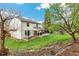 Picturesque backyard featuring a well-maintained lawn, patio, and mature trees at 6712 S Leyden Ct, Centennial, CO 80112