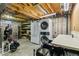 Utility area with washer, dryer, sink, fridge, and storage shelves at 6712 S Leyden Ct, Centennial, CO 80112