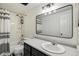 Bright bathroom features a sleek vanity, and modern fixtures at 6712 S Leyden Ct, Centennial, CO 80112