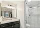 Well-lit bathroom features a sleek vanity, glass shower, and modern fixtures at 6712 S Leyden Ct, Centennial, CO 80112