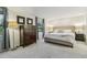 Spacious bedroom with soft carpet, a plush bed, and elegant decor at 6712 S Leyden Ct, Centennial, CO 80112