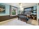 Designed bedroom featuring bed, decor and a sunlit window at 6712 S Leyden Ct, Centennial, CO 80112