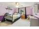 Well-lit bedroom designed with playful decor and a sunlit window at 6712 S Leyden Ct, Centennial, CO 80112