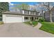 Charming two-story home with a manicured lawn and a two car garage at 6712 S Leyden Ct, Centennial, CO 80112