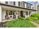 Inviting front porch with charming decor and manicured landscaping, creating a warm welcome at 6712 S Leyden Ct, Centennial, CO 80112