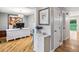 Bright office space with hardwood floors, complemented by an elegant white desk and ample natural light at 6712 S Leyden Ct, Centennial, CO 80112