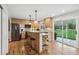 Well-lit kitchen with stainless steel appliances, a functional island with bar seating, and an outdoor view at 6712 S Leyden Ct, Centennial, CO 80112