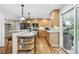 Bright and modern kitchen with stainless steel appliances, granite countertops, hardwood floors and access to backyard at 6712 S Leyden Ct, Centennial, CO 80112