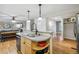 Open concept kitchen with stainless steel appliances, hardwood floors, and a view into the living area at 6712 S Leyden Ct, Centennial, CO 80112