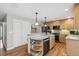 Well-equipped kitchen with granite countertops, stainless steel appliances, and wood floors at 6712 S Leyden Ct, Centennial, CO 80112