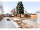 Spacious backyard with a large tree and privacy fence, ideal for outdoor activities at 333 Quitman St, Denver, CO 80219