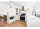 Modern kitchen with stainless steel appliances and white cabinets at 333 Quitman St, Denver, CO 80219