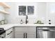 Close-up view of kitchen sink, faucet, and stainless steel appliances at 333 Quitman St, Denver, CO 80219