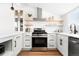 Modern kitchen with white cabinets and stainless steel appliances at 333 Quitman St, Denver, CO 80219