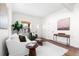 Cozy living room featuring hardwood floors and bright natural lighting at 333 Quitman St, Denver, CO 80219