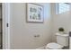 Clean and modern bathroom with toilet and open shelving at 19078 E 94Th Pl, Commerce City, CO 80022