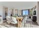 Open concept dining area with wood table and chairs overlooking living room at 19078 E 94Th Pl, Commerce City, CO 80022