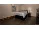 Serene bedroom with hardwood floors, a large window, and a comfortable bed at 54 Zaza Ln, Evergreen, CO 80439