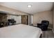Cozy bedroom with a stone fireplace and a wooden sliding door at 54 Zaza Ln, Evergreen, CO 80439