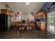 Well-equipped kitchen featuring wooden cabinets, stainless steel appliances and a dining table at 54 Zaza Ln, Evergreen, CO 80439