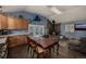 Inviting kitchen and dining area with stone fireplace, seamlessly connecting indoor and outdoor living spaces at 54 Zaza Ln, Evergreen, CO 80439
