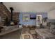 Comfortable living room featuring a stone fireplace, hardwood floors and a cozy sofa at 54 Zaza Ln, Evergreen, CO 80439