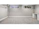 Finished basement with plush carpeting, built-in desk space and bright natural light at 6508 E Euclid Pl, Centennial, CO 80111