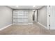 Basement bonus room with plush carpeting, built-in shelving and staircase access at 6508 E Euclid Pl, Centennial, CO 80111