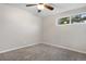 Bedroom with carpet flooring, neutral paint, and a window at 6508 E Euclid Pl, Centennial, CO 80111