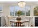 Cozy dining area features a round table, four chairs and bright lighting at 6508 E Euclid Pl, Centennial, CO 80111