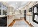 Spacious kitchen with white cabinets, stainless steel appliances, and a copper farmhouse sink at 6508 E Euclid Pl, Centennial, CO 80111