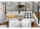 Cozy sitting area with two chairs and access to the staircase and kitchen at 6508 E Euclid Pl, Centennial, CO 80111