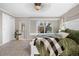 Spacious bedroom with a cozy carpet, a white bed frame, and window to the outside at 6508 E Euclid Pl, Centennial, CO 80111