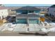 Aerial view of a duplex featuring three garage doors and landscaping at 14106 Red Cosmos St, Parker, CO 80134