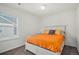 Charming bedroom with orange bedding and plenty of natural light at 14106 Red Cosmos St, Parker, CO 80134