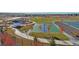 Aerial view of a community park featuring a basketball court, picnic area, and playground at 14106 Red Cosmos St, Parker, CO 80134