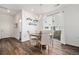 Dining room with a wooden round table, chandelier lighting and access to the backyard at 14106 Red Cosmos St, Parker, CO 80134