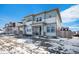 Charming two-story home with blue and gray siding and large windows at 14106 Red Cosmos St, Parker, CO 80134